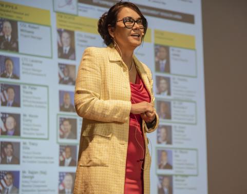 Program Executive Officer Chérie A. Smith speaks about recent leadership changes during a town hall event held July 23, 2019 at the Wood Theater on Fort Belvoir, Virginia. (U.S. Army photo by Laura Edwards, PEO EIS)