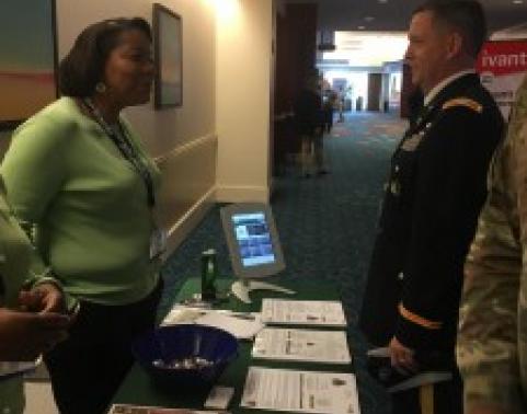 Ms. Stacy Watson (left) briefing COL Kenneth G. Haynes, Director for the Army Global Modernization Team, on CHESS’s mission.