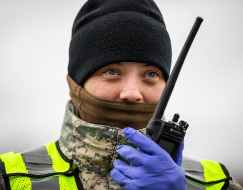 Soldier wearing a face mask on a Radio