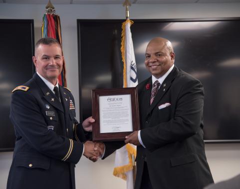 Col. R.J. Mikesh, left, and Keith Baylor, right, at the AMIS assumption of charter ceremony. (U.S. Army photo by Scott Weaver, PEO EIS Strategic Communication Directorate)