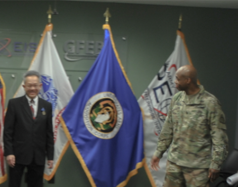 GFEBS leaders conduct retirement ceremony in conf rm in front of flags