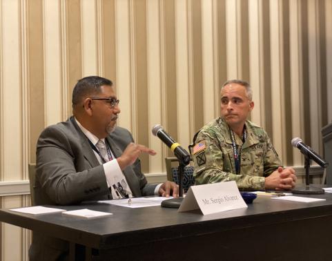 Photo of Mr. Sergio Alvarez and COL Mark Taylor participating in the AFCEA Belvoir Industry Days APEO Networks Panel