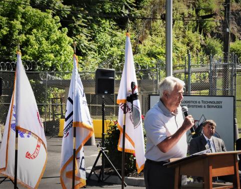 Jim Graham, a former ALTESS employee, speaks about his time in the organization, during an anniversary ceremony held June 14, 2019 in Radford, Virginia. Also pictured are ALTESS Product Director Tim Hale (center) and former PEO Gary Winkler (right). 