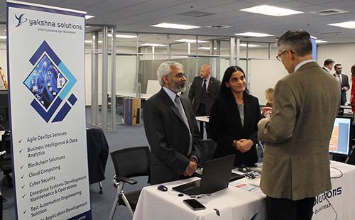 A Forge Storm vendor prepares to demonstrate his company’s defensive cyber product. 