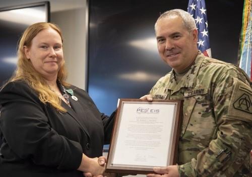 Col. Costas thanks Ms. Kimberly Davidson for her years of service to Land Mobile Radio. 
